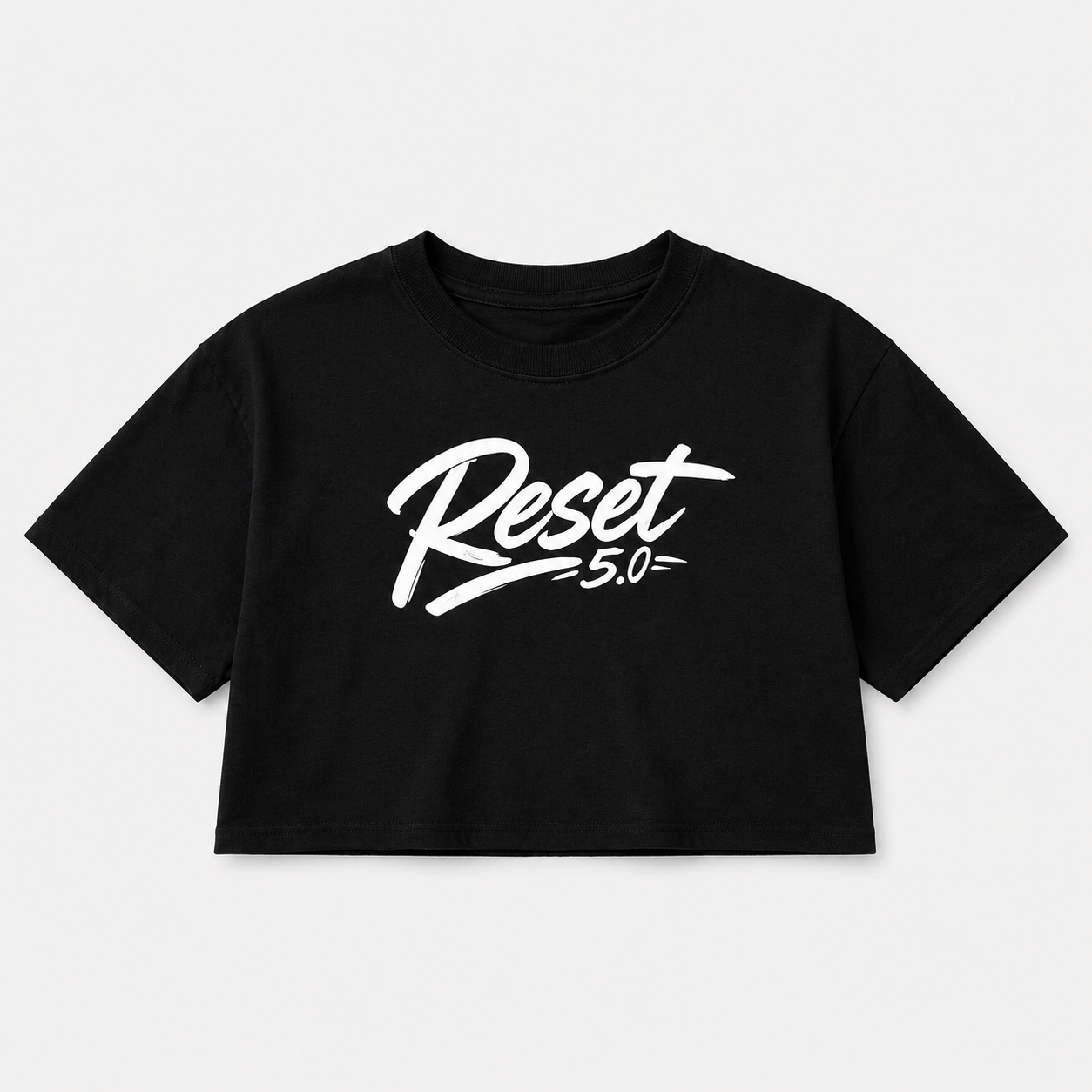 Black boxy fit cropped t-shirt with large white Reset logo on the front