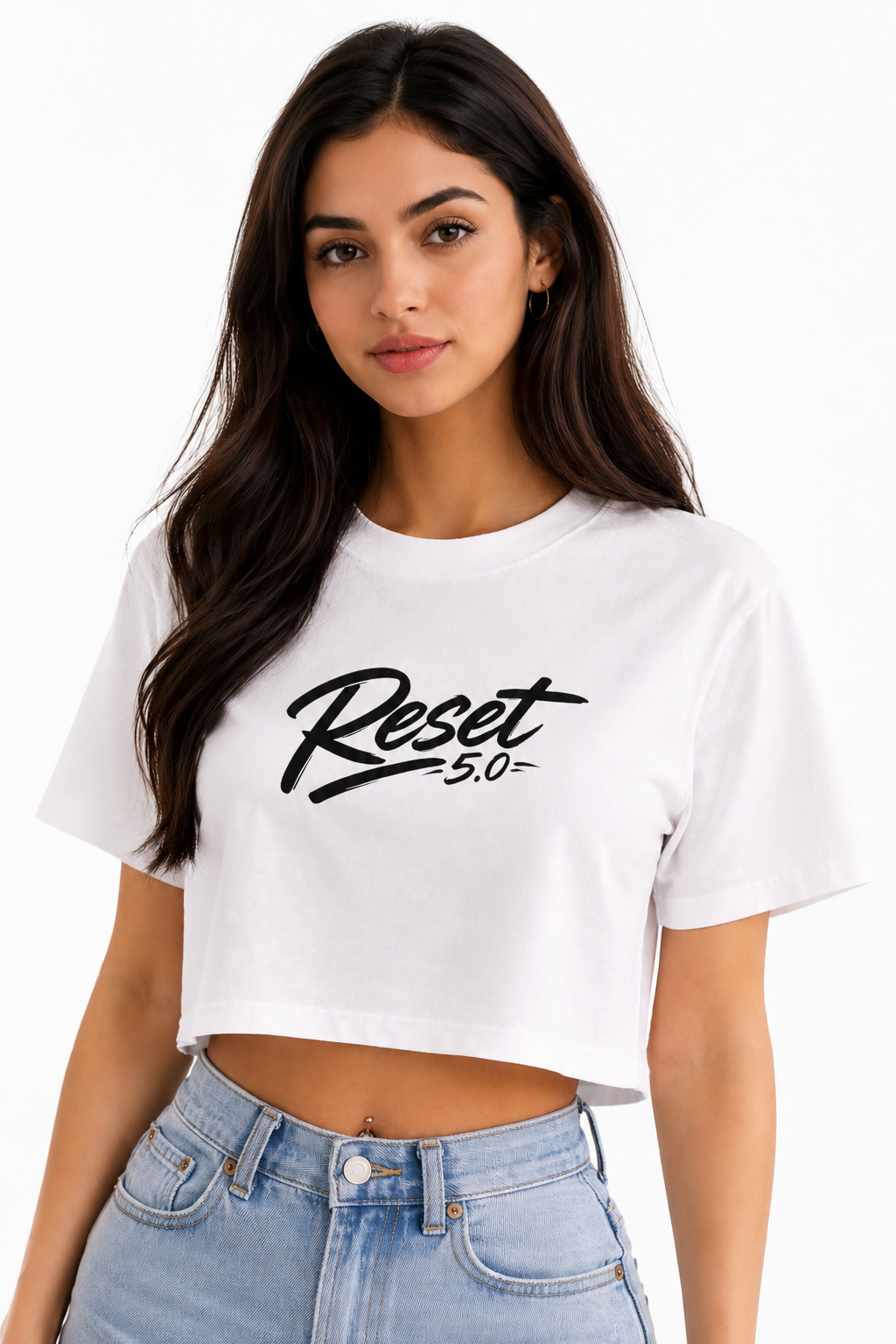 Woman wearing a white crop top with 'Reset 5.0' text on a white background
